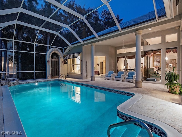 view of swimming pool with a lanai and a patio area