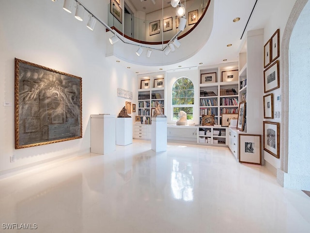 hallway featuring built in shelves