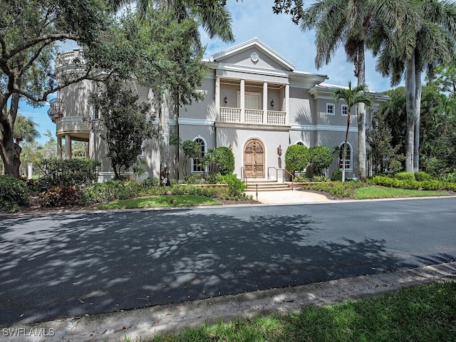 neoclassical / greek revival house with a balcony