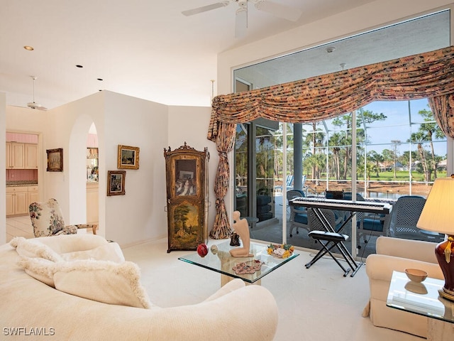 living room with light carpet and ceiling fan