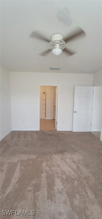 empty room with carpet flooring and ceiling fan