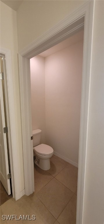 bathroom featuring tile patterned floors and toilet