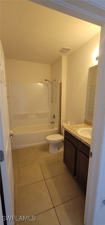 full bathroom with tile patterned floors, vanity, shower / bath combination, and toilet