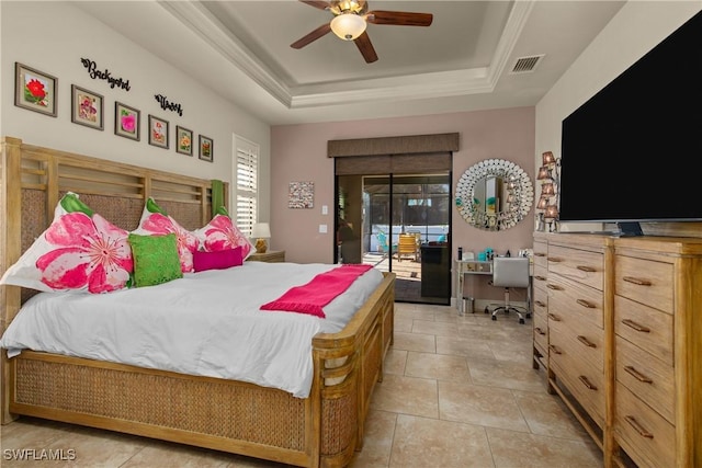 bedroom with ceiling fan, a tray ceiling, light tile patterned floors, and access to exterior