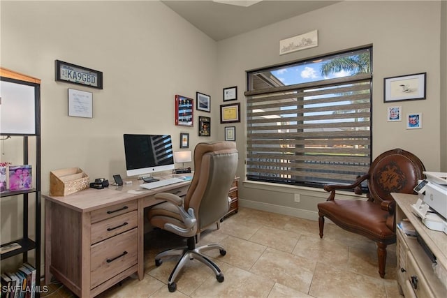 home office featuring light tile patterned flooring