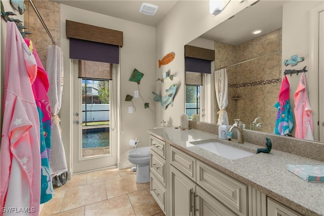 bathroom with toilet, tile patterned flooring, a shower with shower curtain, and vanity