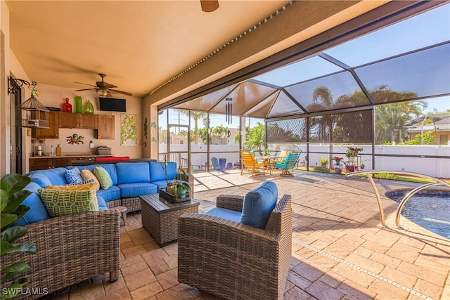 view of patio with a lanai, ceiling fan, and outdoor lounge area