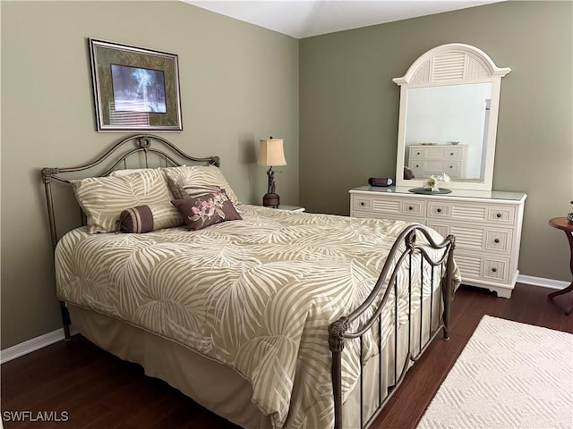 bedroom with dark wood-type flooring