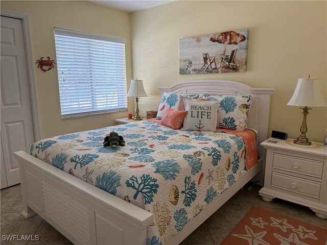 bedroom featuring tile patterned floors