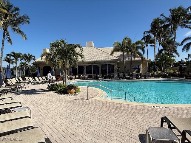 view of swimming pool featuring a patio area