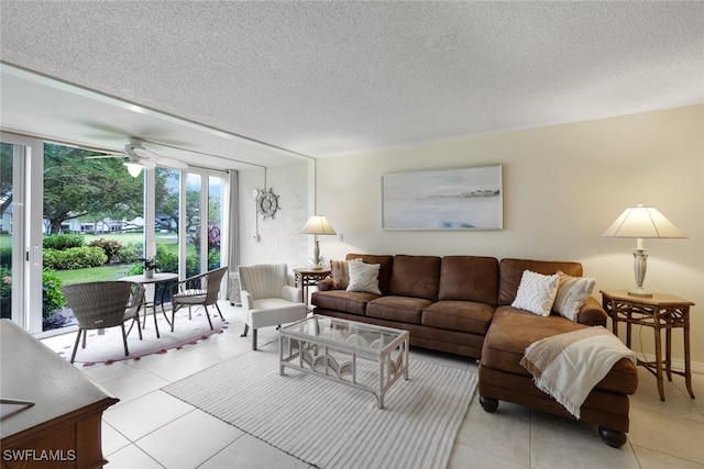 tiled living room featuring a textured ceiling and ceiling fan