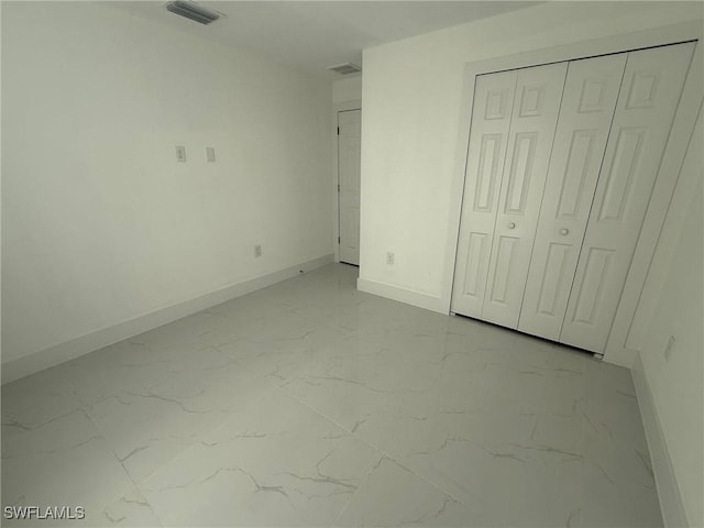 unfurnished bedroom featuring a closet