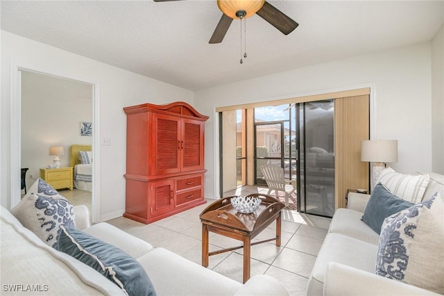 tiled living room featuring ceiling fan