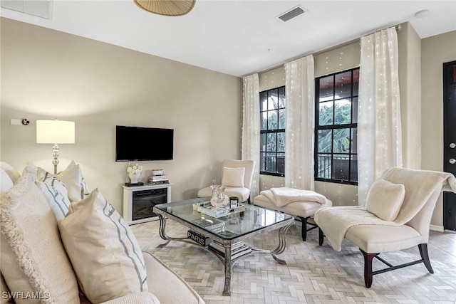 living room with light parquet floors