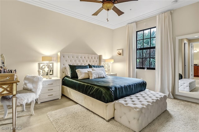 carpeted bedroom with ceiling fan and ornamental molding