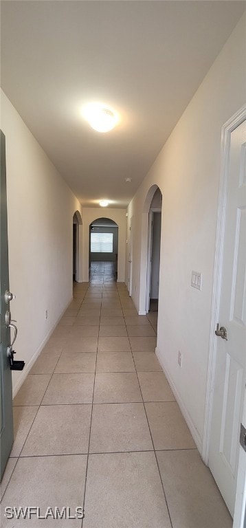 corridor with light tile patterned floors