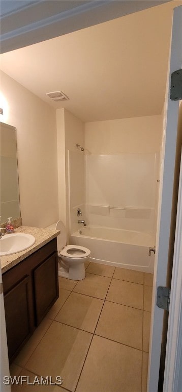 full bathroom featuring tile patterned floors, vanity, toilet, and shower / bathing tub combination