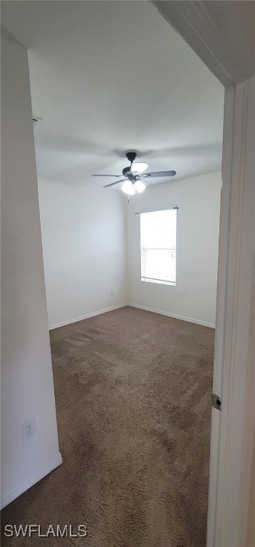 carpeted empty room with ceiling fan