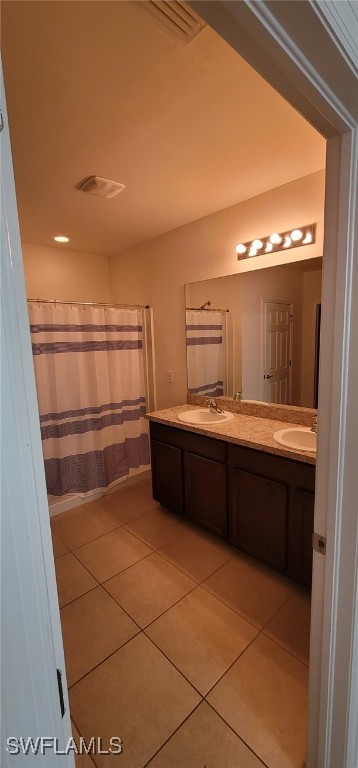 bathroom featuring tile patterned floors and vanity