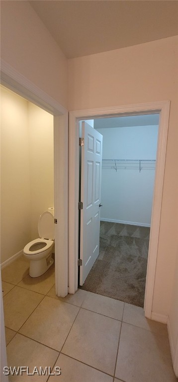 bathroom featuring tile patterned floors and toilet