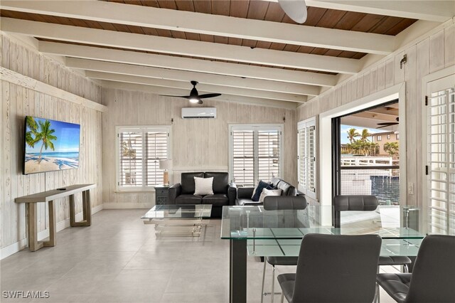 dining area featuring a wall unit AC, vaulted ceiling with beams, a wealth of natural light, and wood walls