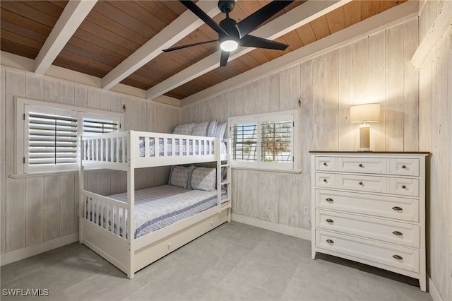 unfurnished bedroom with wood ceiling, wood walls, and vaulted ceiling with beams