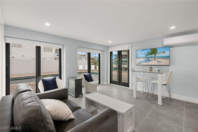 living room featuring a wall mounted air conditioner and french doors