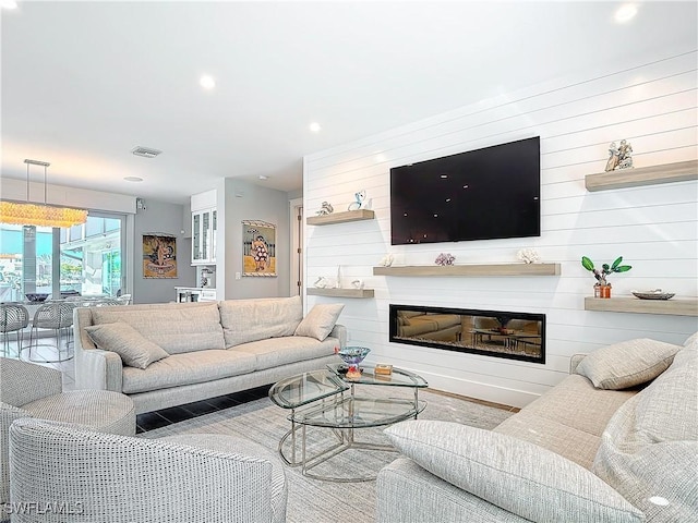 living room with wood walls