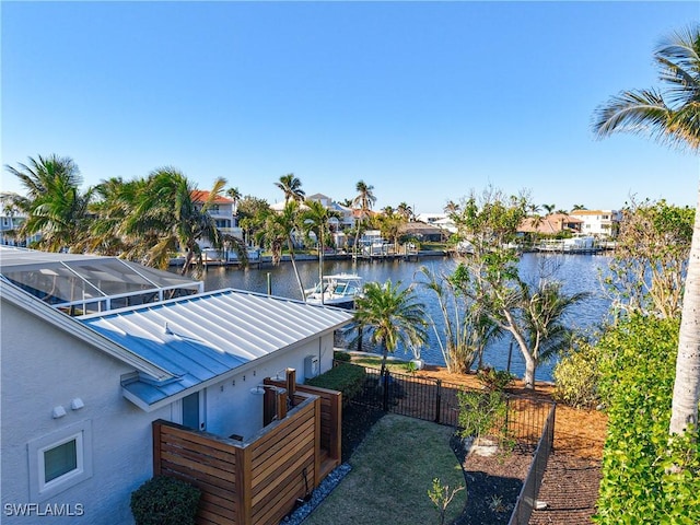 dock area with a water view and a lanai