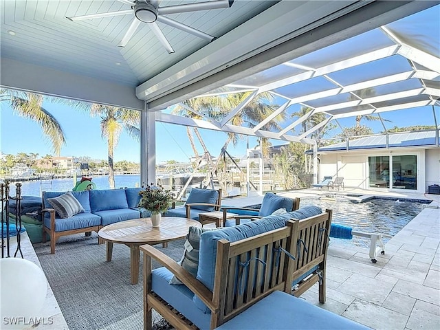 view of patio / terrace featuring an outdoor living space, a water view, and a lanai