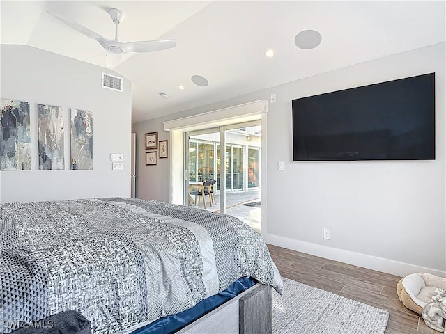 bedroom featuring access to exterior, ceiling fan, wood-type flooring, and vaulted ceiling