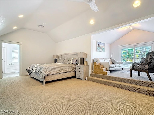 carpeted bedroom with lofted ceiling