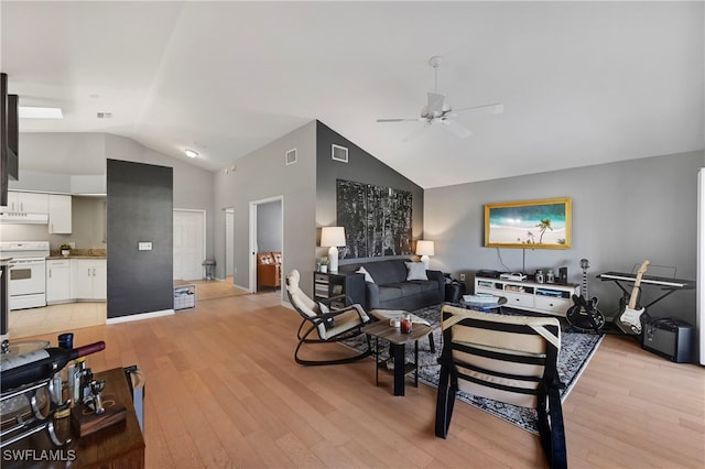 living room featuring ceiling fan, light hardwood / wood-style floors, and lofted ceiling