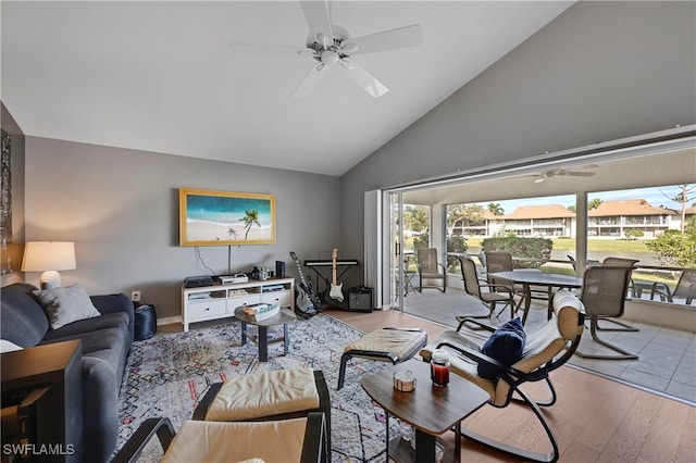 living room with ceiling fan, light wood-type flooring, and lofted ceiling