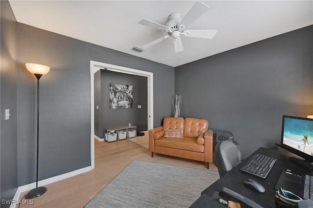 office area with ceiling fan and light wood-type flooring