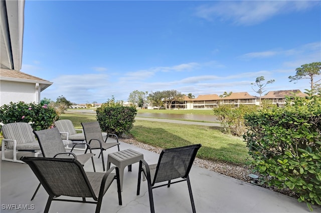 view of patio with a water view