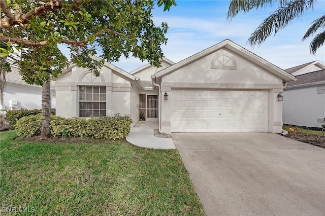 ranch-style house with a garage and a front lawn