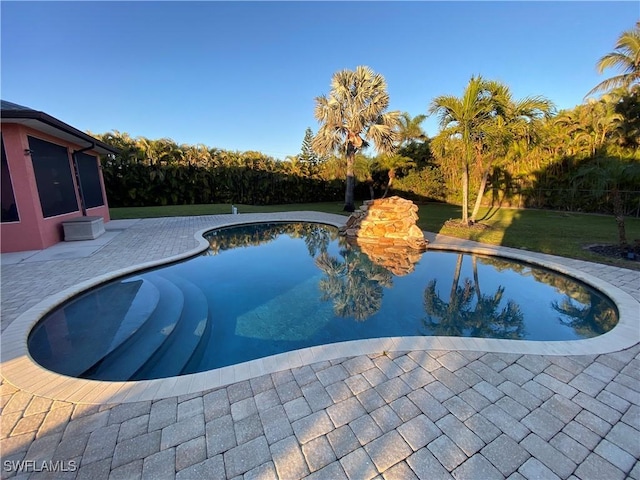 view of pool featuring a patio