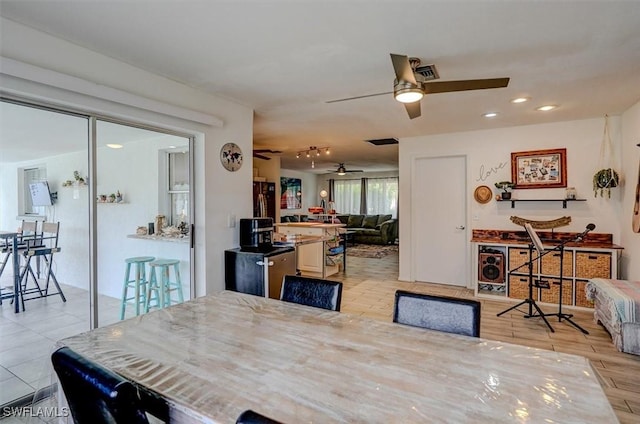 dining space with ceiling fan