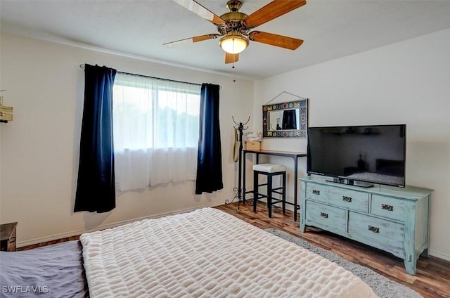 bedroom featuring hardwood / wood-style flooring and ceiling fan