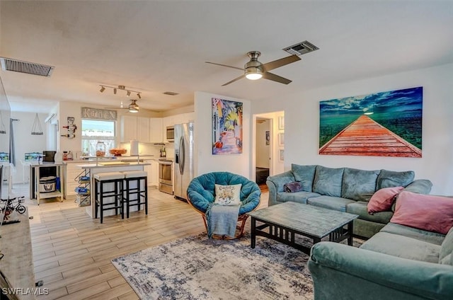 living room with ceiling fan