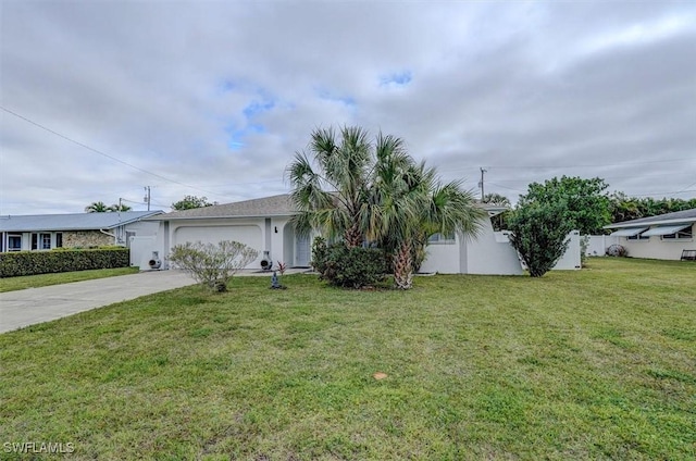 view of front of property with a front yard and a garage