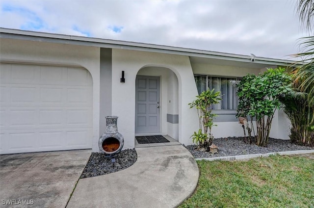 view of exterior entry featuring a garage