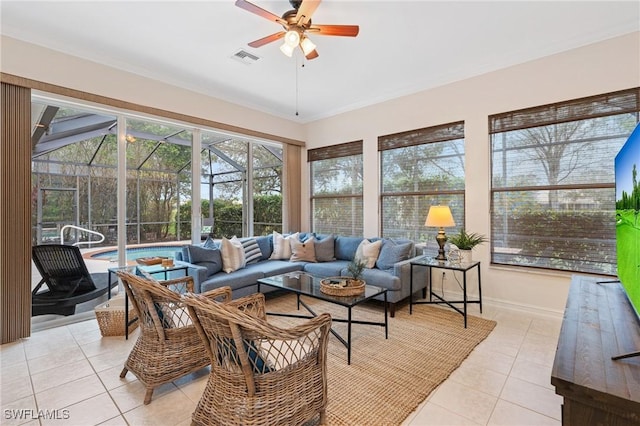 sunroom / solarium featuring ceiling fan and visible vents