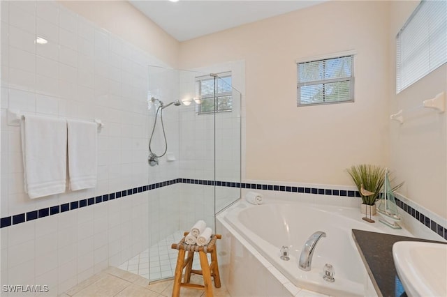 bathroom featuring sink, tile patterned flooring, and separate shower and tub