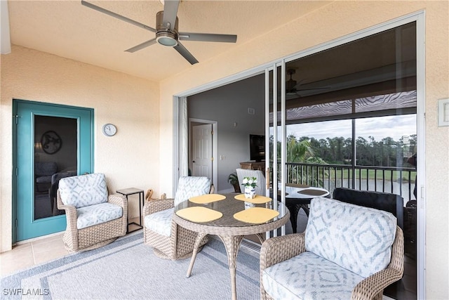 sunroom with a ceiling fan