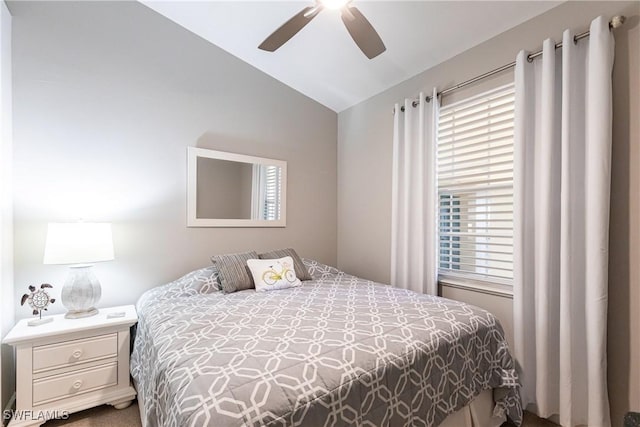 bedroom with lofted ceiling and ceiling fan