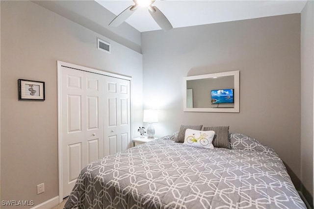 bedroom featuring a closet, visible vents, and a ceiling fan