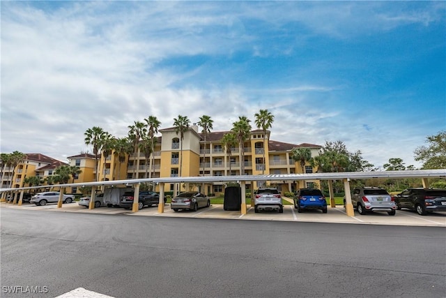 view of building exterior with covered parking