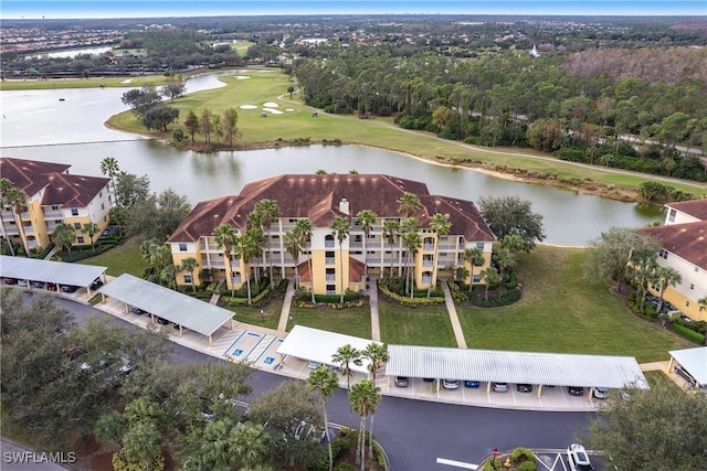 birds eye view of property featuring a water view and view of golf course